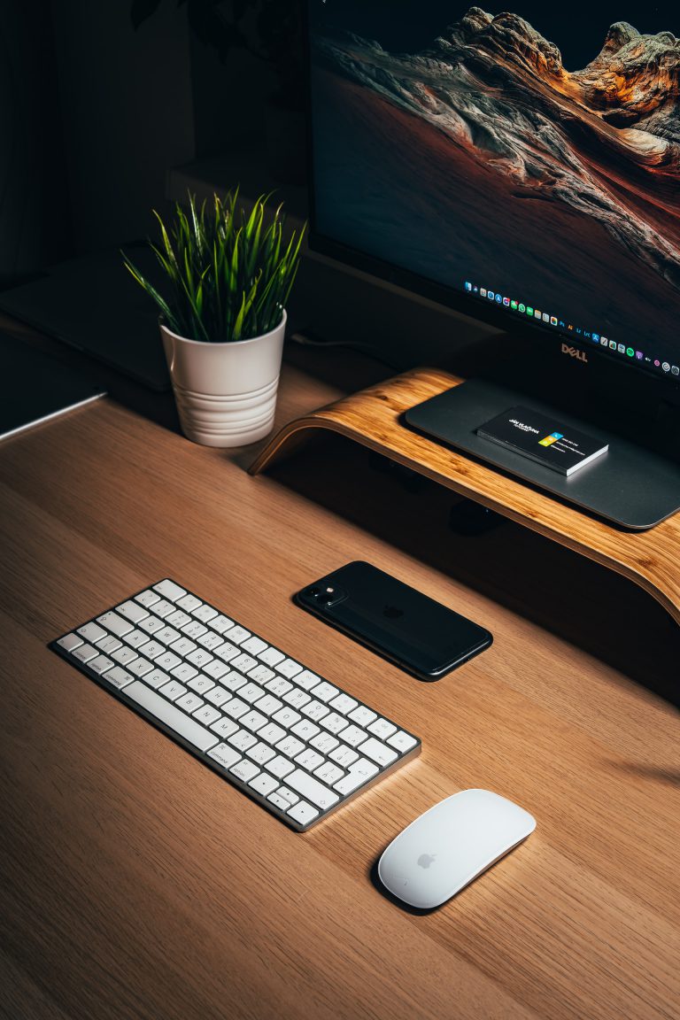 Computer with mouse, keyboard, and phone on desk. — Neustart Digital